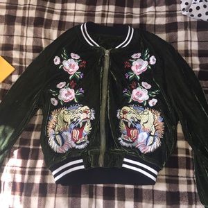Jacket with lion and flower patches